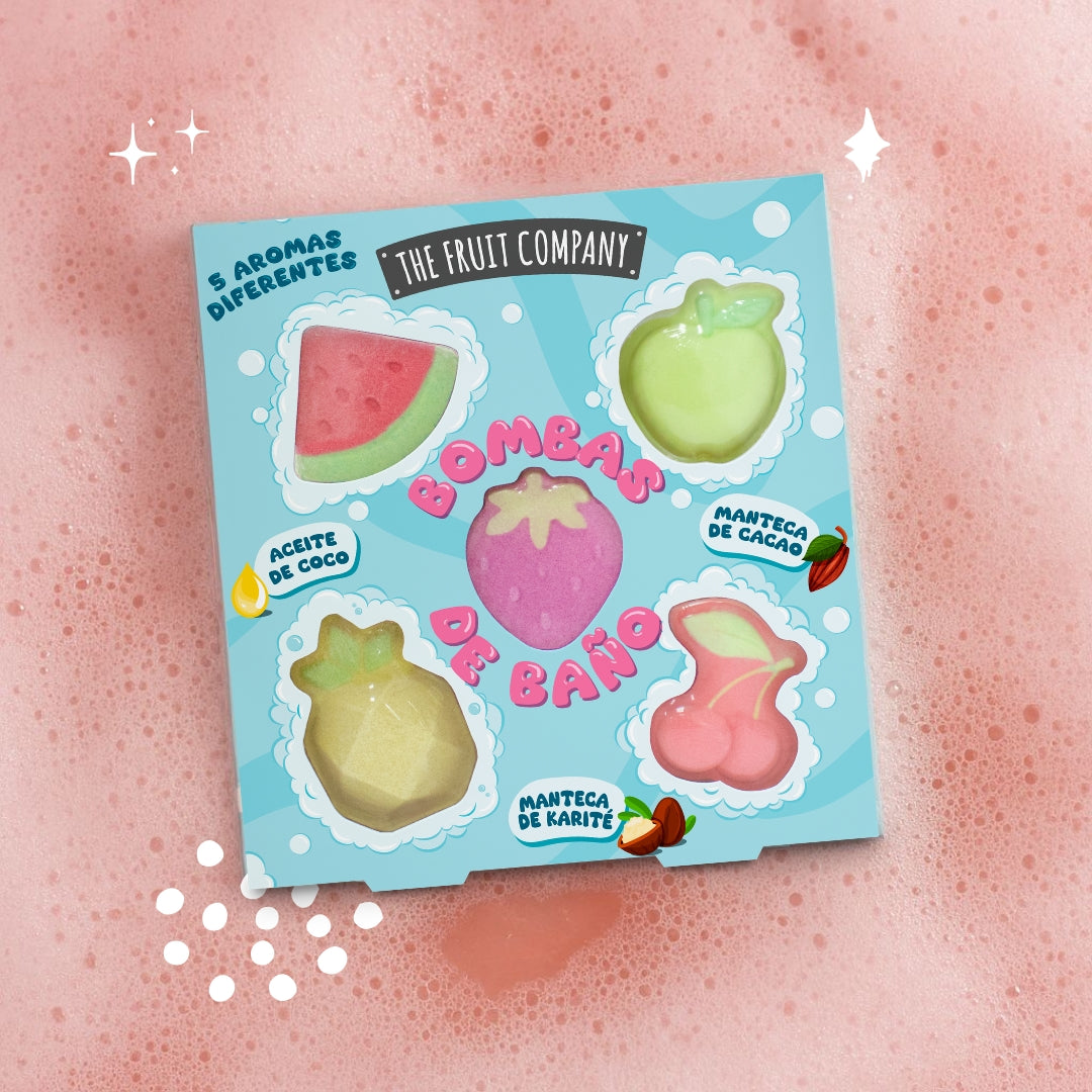 Packaging of bath bombs with fruit designs on a pink background