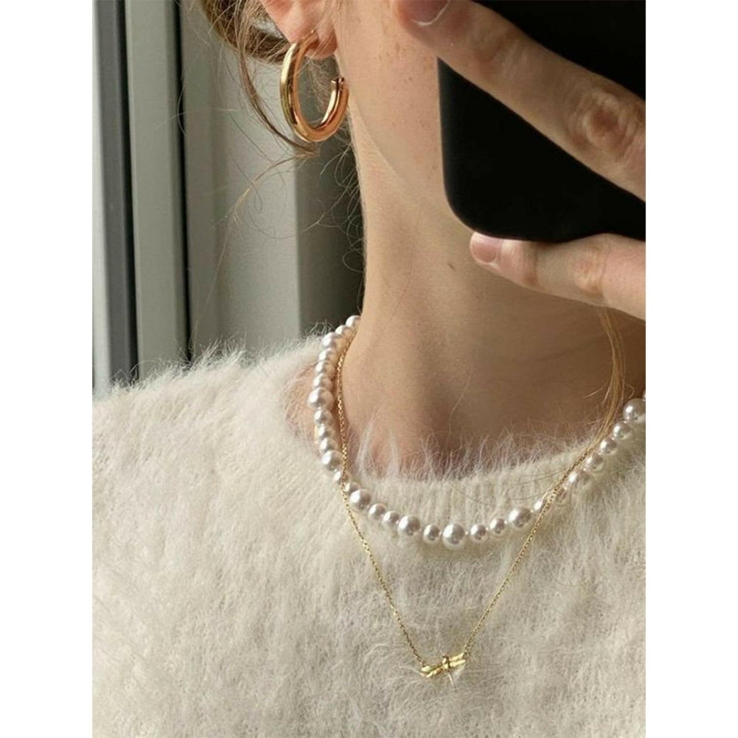 Light Academia style clothes and accessories inside a mysterious box, blending vintage charm with modern elegance