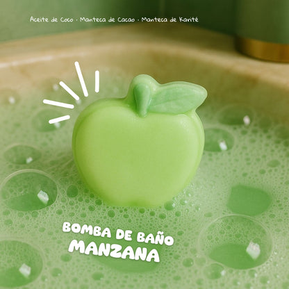 Green apple-shaped bath bomb in a green bath with bubbles, labeled 'Bomba de Baño Manzana'.