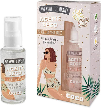 The Fruit Company Aceite Seco bottle and packaging with a woman in a swimsuit on a white background