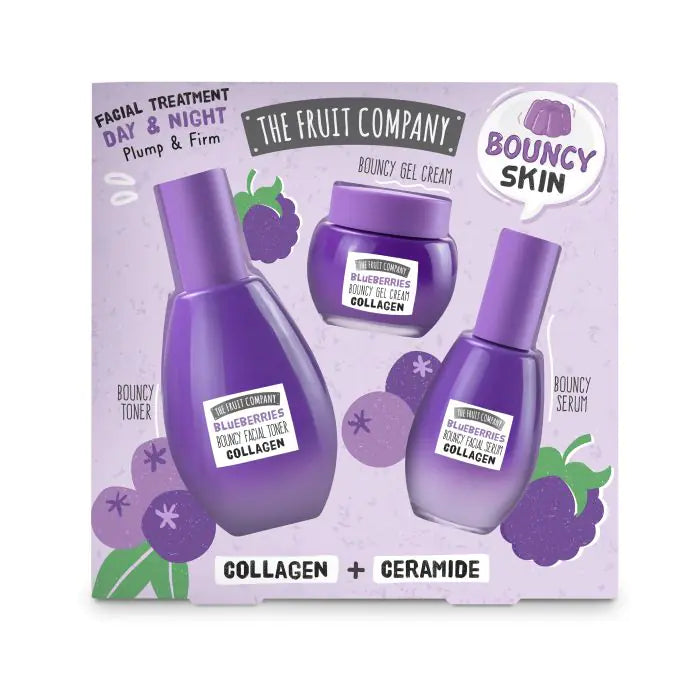 Facial treatment set with bottles and a jar on a purple background, featuring 'The Fruit Company' branding.