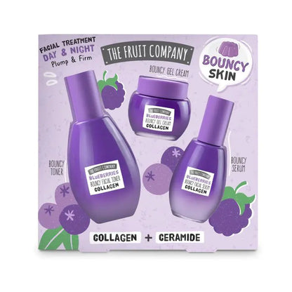 Facial treatment set with bottles and a jar on a purple background, featuring 'The Fruit Company' branding.