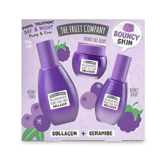 Facial treatment set with bottles and a jar on a purple background, featuring 'The Fruit Company' branding.
