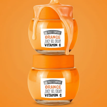 Two jars of 'Orange Juicy Gel Cream Vitamin C' on an orange background