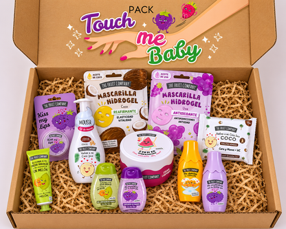 Box of 'Touch Me Baby' skincare products with various items including bottles and packets.