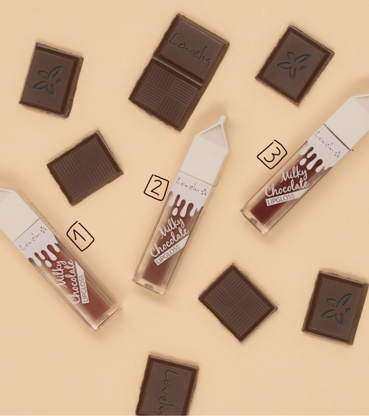 Chocolate bars and lip glosses labeled 'Milky Chocolate' on a beige background