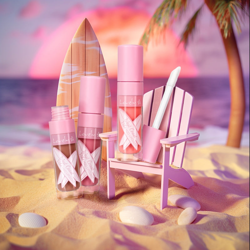 Pink lip products on a beach with a palm tree and sunset in the background