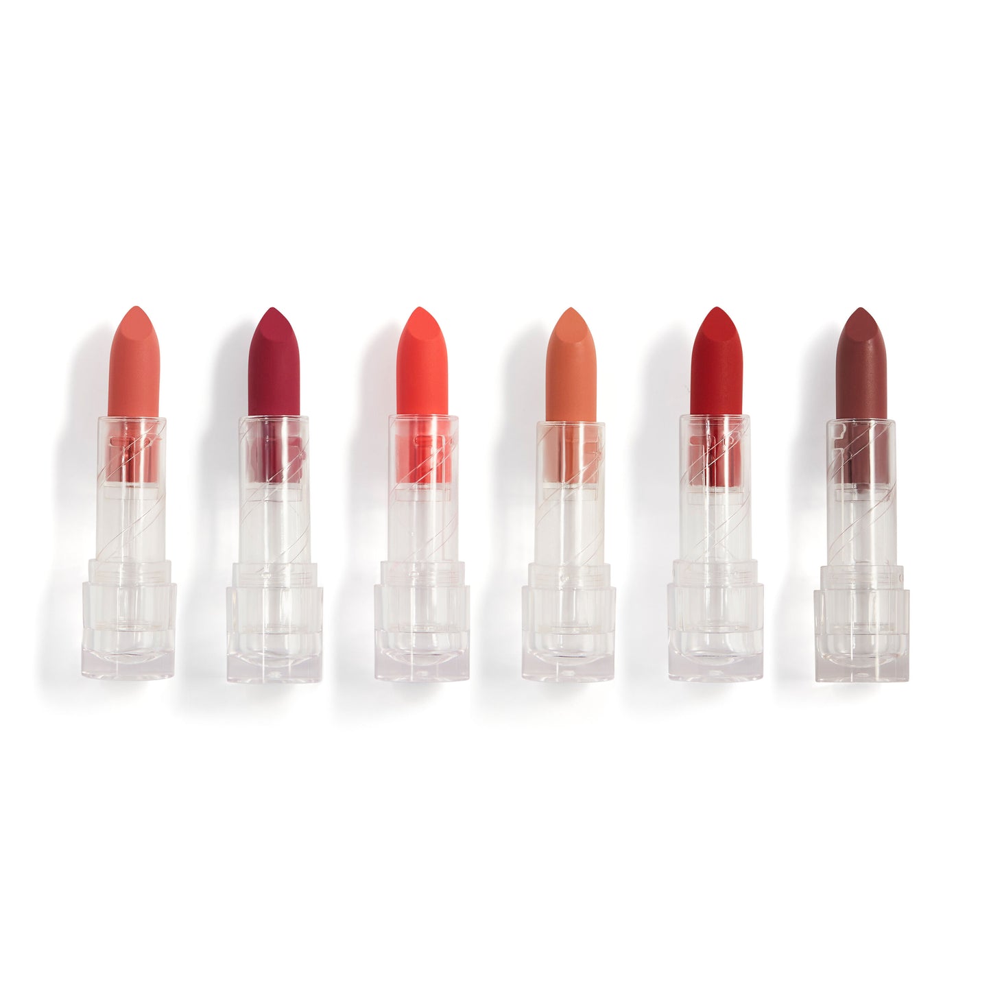 Set of six lipsticks in various shades on a white background
