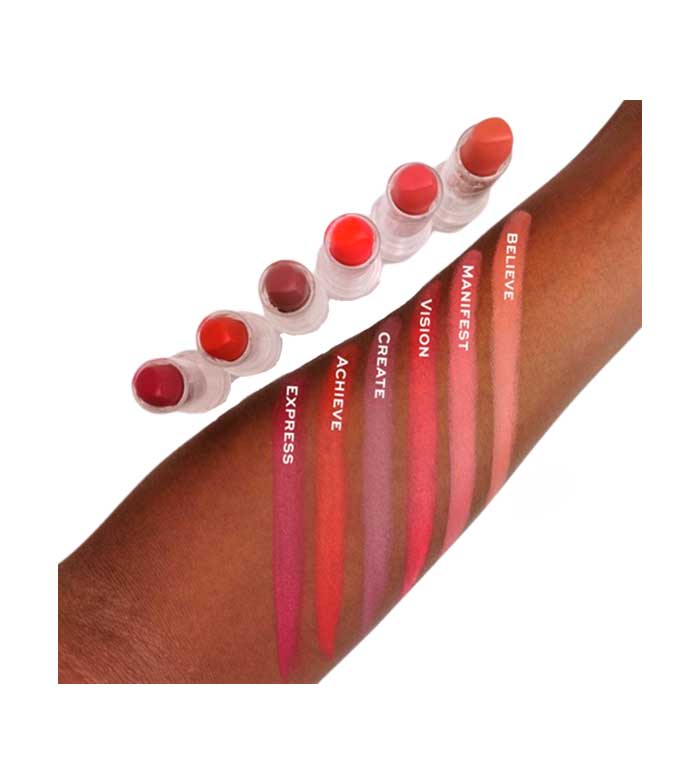 Set of red lip glosses on a brown arm with motivational phrases.