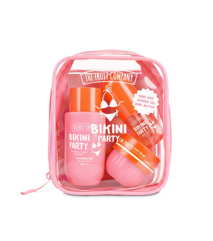 A clear zippered cosmetic bag filled with pink and orange tropical-themed body care products from The Fruit Company, including a shower gel, body wash, and lip balm, labeled 'Bikini Party'.